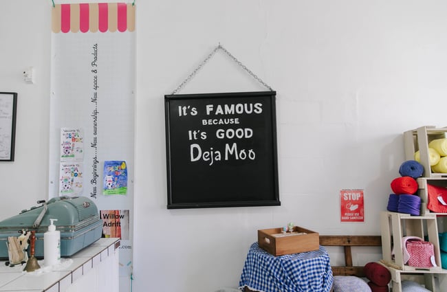 Sign on the wall at Deja Moo in Ōamaru.