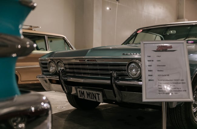 Close up of Chevrolet bumper at Harmon's Motor Museum.
