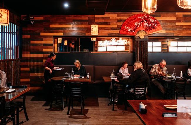 Customers sitting at table at HARU.