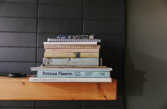 Books stacked on a shelf.