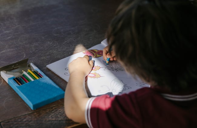 Little kid colouring in.