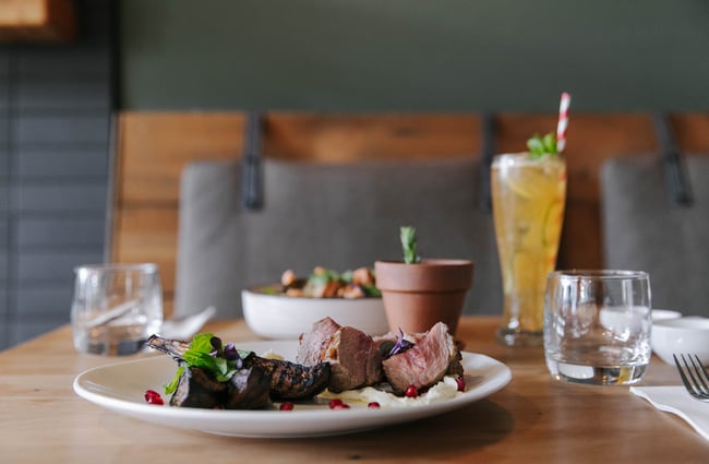 Steak meal on a table.