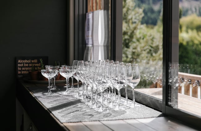 Rows of wine glasses glistening in the sunshine.