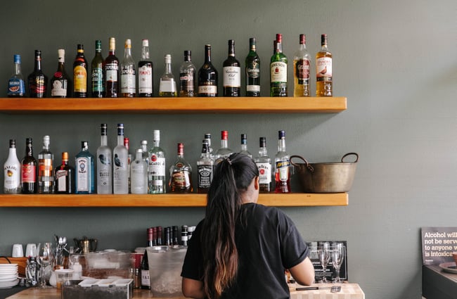 Woman preparing drink.