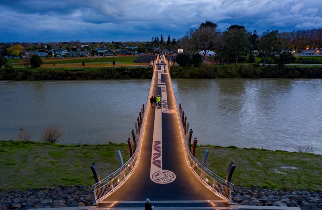 The He Ara Kotahi Bridge at night.