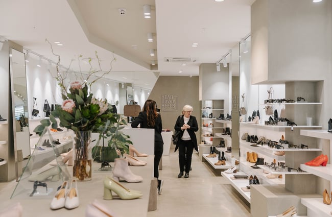 A woman looking at shoes at Head Over Heels in Christchurch.