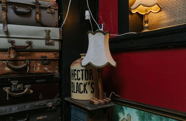 Vintage boggle and lamp in a dark corner of the bar at Hector Black's in Timaru.