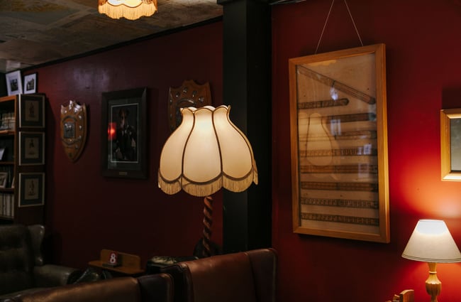 Old lamps lighting up a dark corner of the bar at Hector Black's in Timaru.