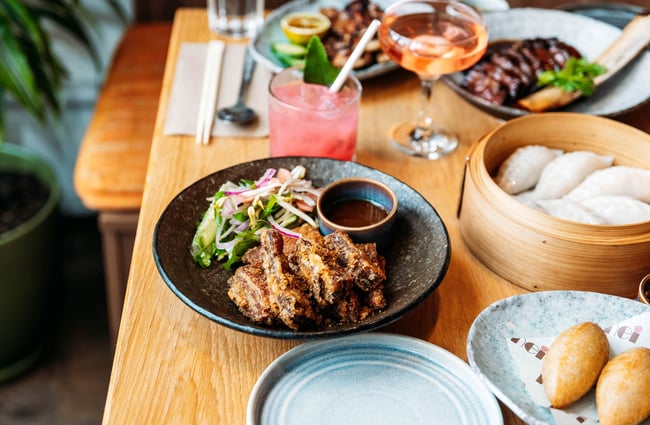 Pork Belly on table with other plates at Hei Restaurant in Wellington
