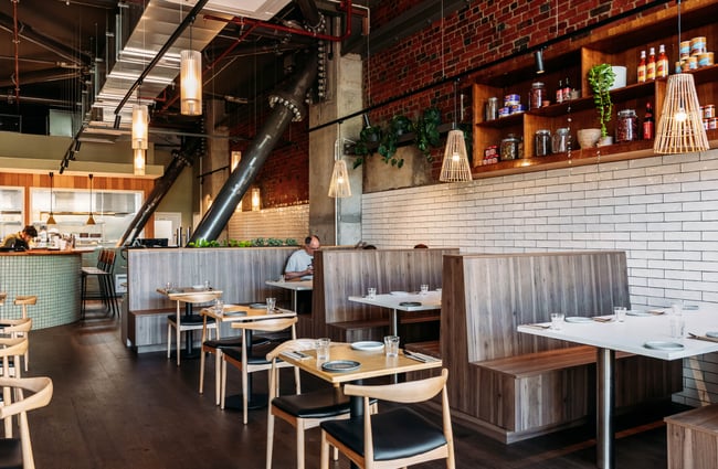 Wide shot of the dining room including booth seating at Hei.