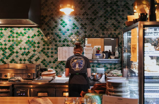 A staff member working behind the counter.