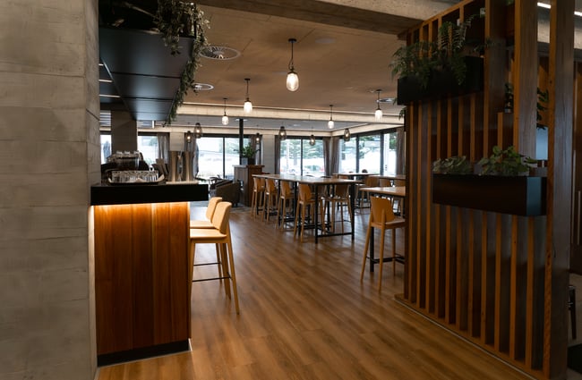 Seating areas inside the restaurant and at the bar at Hiku.