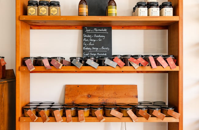 Products lined up on shelves at Hill Road Orchard & Farm Shop.