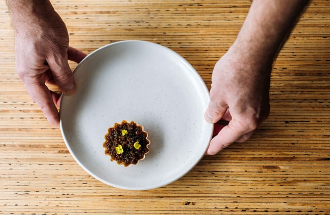 Close up of a tart on a plate.
