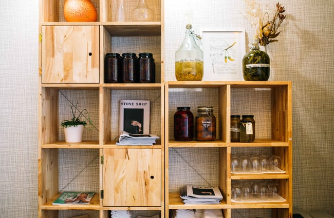 Jars of preserves on shelves.