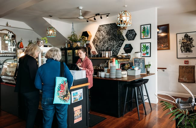 Customers being served by a staff member.