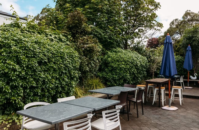 Outdoor tables and chairs in Eastbourne on a cloudy day.
