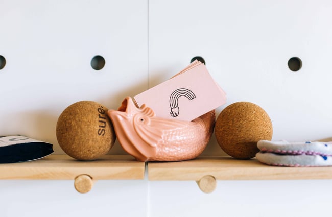 Pilates accessories on a shelf.