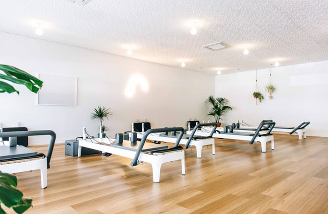 Reformers machines used in the art of mindful pilates.