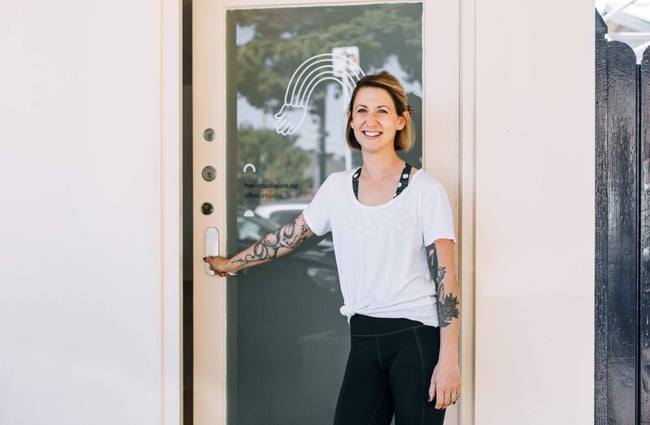 Hoi owner Sasha in the doorway of the studio.