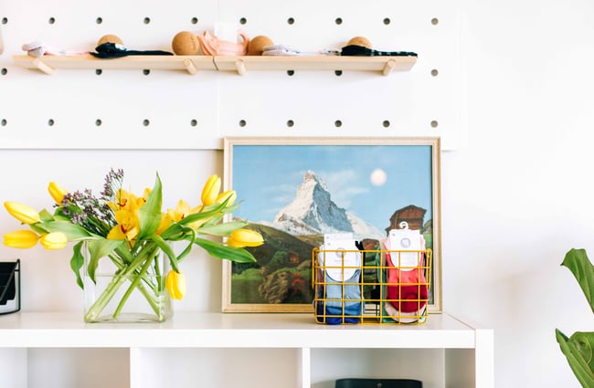 Wall of shelves with pilates accessories.