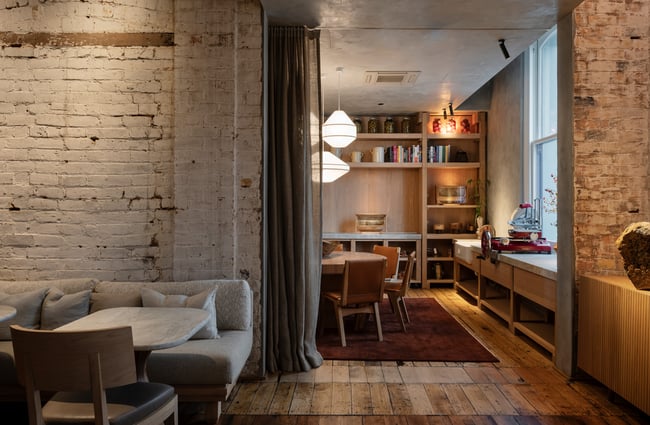 A beautifully decorated living area inside a stylist hotel room.