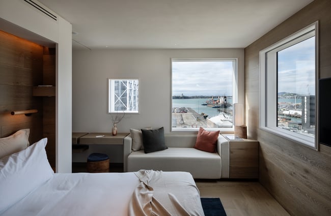 A stylist Hotel bedroom decorated in cool grey tones.