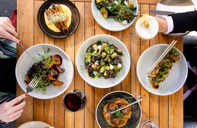 A birdseye view of plates of food on a table.