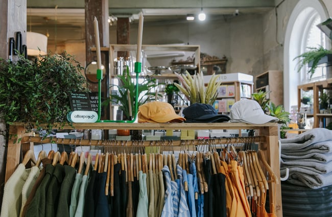 Clothing and hats on display inside Housekeepers.