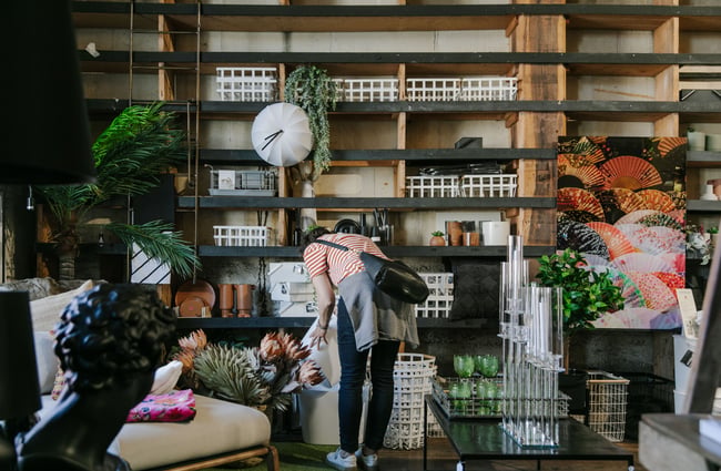 A woman browsing the shelves at Housekeepers.