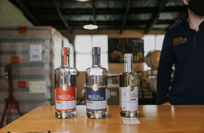 Close up of three gin bottles on a table at Humdinger Gin Distillery in Geraldine.