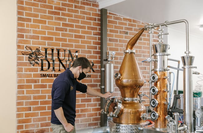 A staff member working the gin stills at Humdinger Gin Distillery in Geraldine.