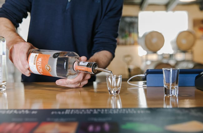Gin being poured into a shot glass at Humdinger Gin Distillery in Geraldine.