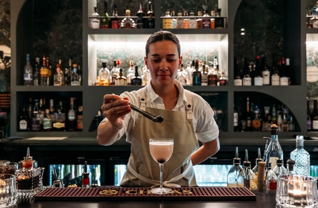 Bartender garnishing a cocktail at Hummingbird.