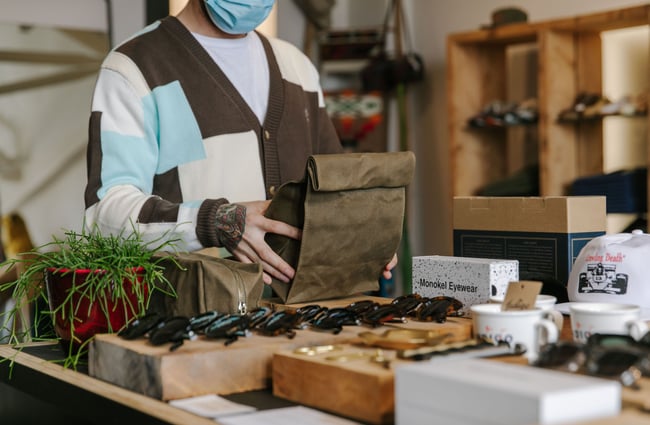 Dom holding a oil cloth bag from Indigo & Provisions, Christchurch.