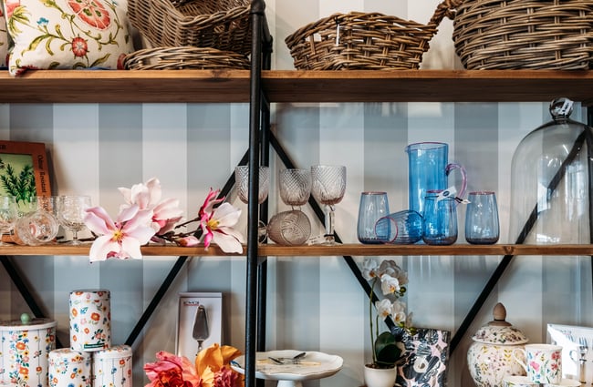 Glassware on shelves inside Intrigue Boutique in Bulls.