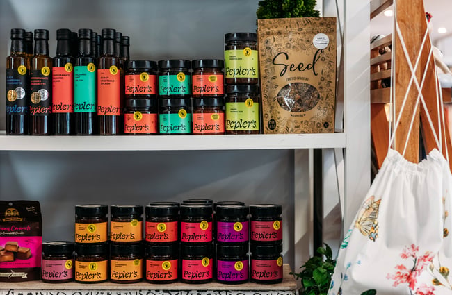 Chutneys, oils and seeds on shelves in Intrigue Boutique in Bulls.