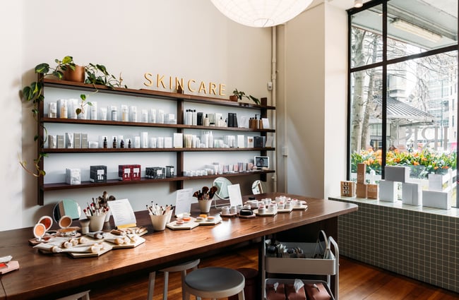 Rows of skincare products on shelves inside a retail store.
