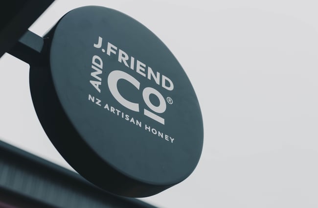 Circle sign in the exterior of the J Friend & Co store.