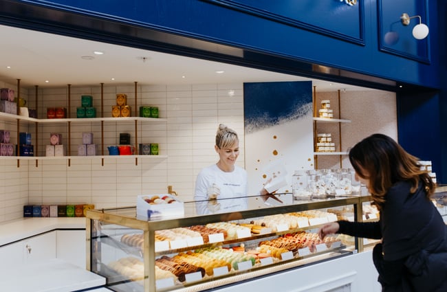 Blue shop exterior of J’aime les macarons in Christchurch.