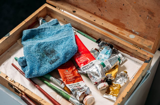A close up of paints on a table.