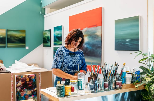 A woman working at a counter.