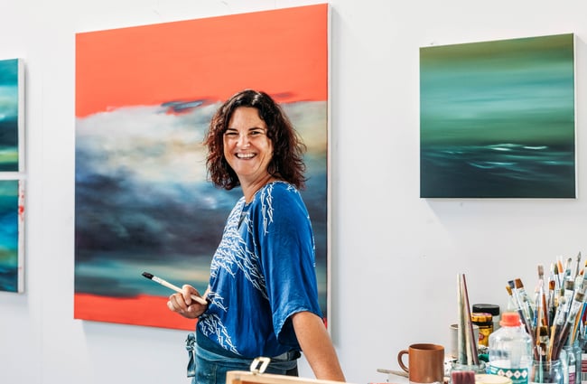 A woman smiling to camera.
