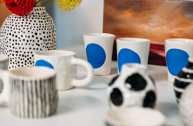 White mugs with blue dots.