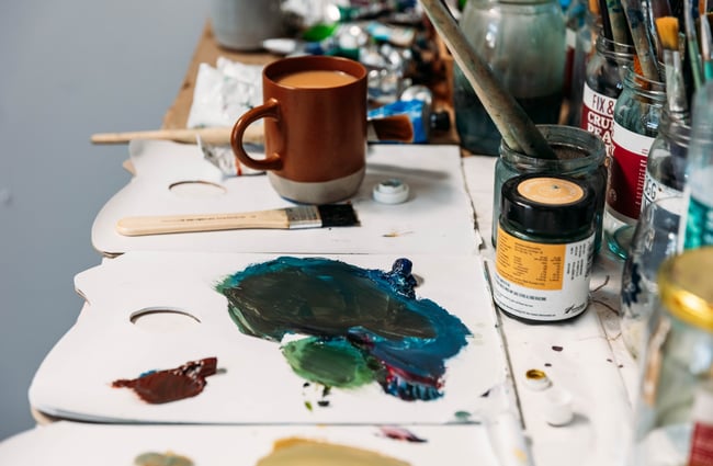 Green paint on a table.