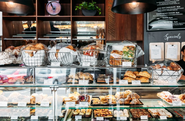 Cabinet full of sandwiches, pastries and other goods at Janus Bakkerij.
