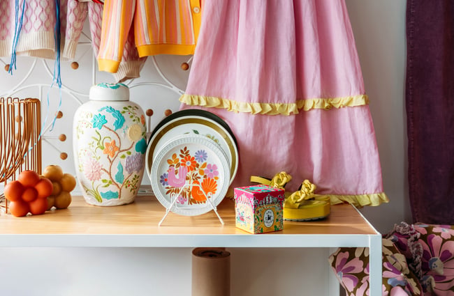 A close up of vintage wares on a small table.