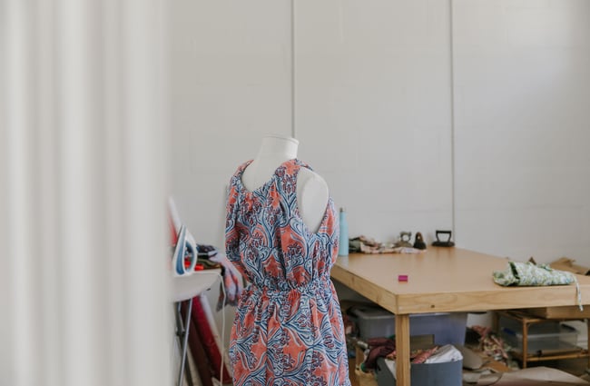A close up of a pink and blue dress on a mannequin.