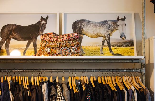 Patterned bag on shelves.