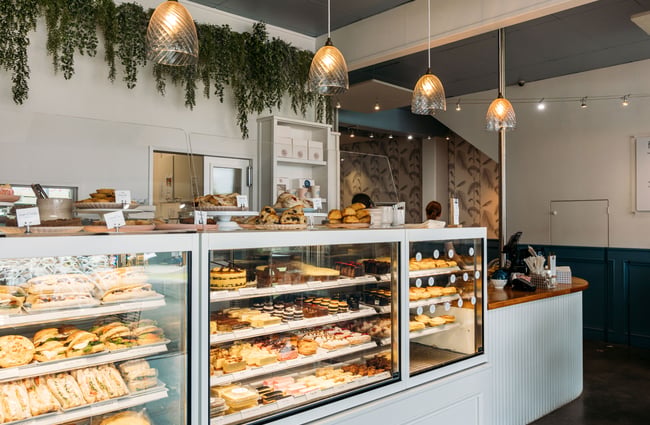 A large glass cabinet at the counter of Joe and Joy cafe.